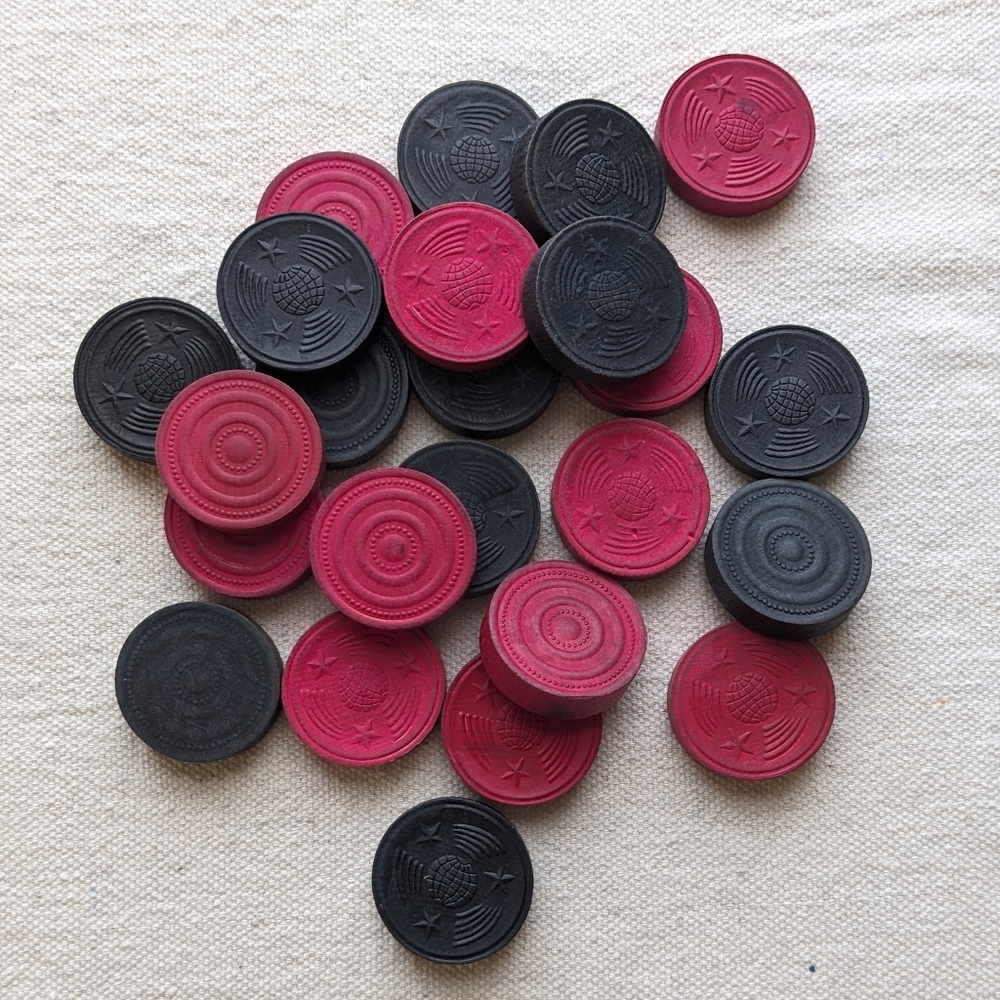 Vintage wooden checker pieces
